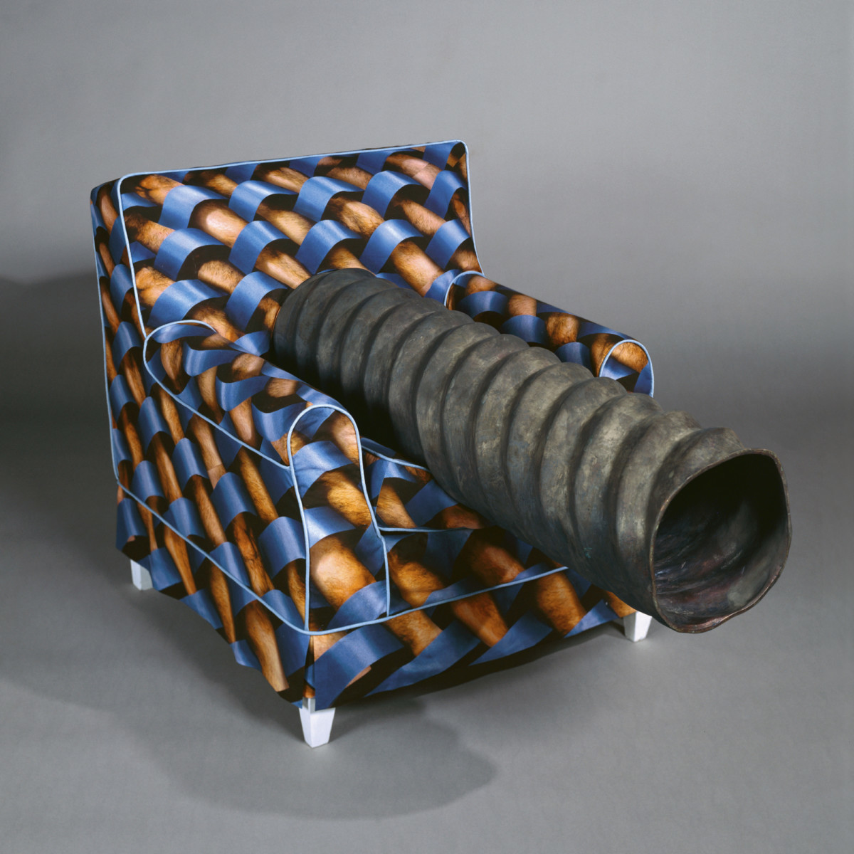 <p><em>Chair with Pipe</em> 1994–1995<br />Wood, bronze, plastic, printed cotton fabric, paint<br />Emanuel Hoffman Foundation, on permanent loan to Öffentliche Kunstsammlung Basel</p>