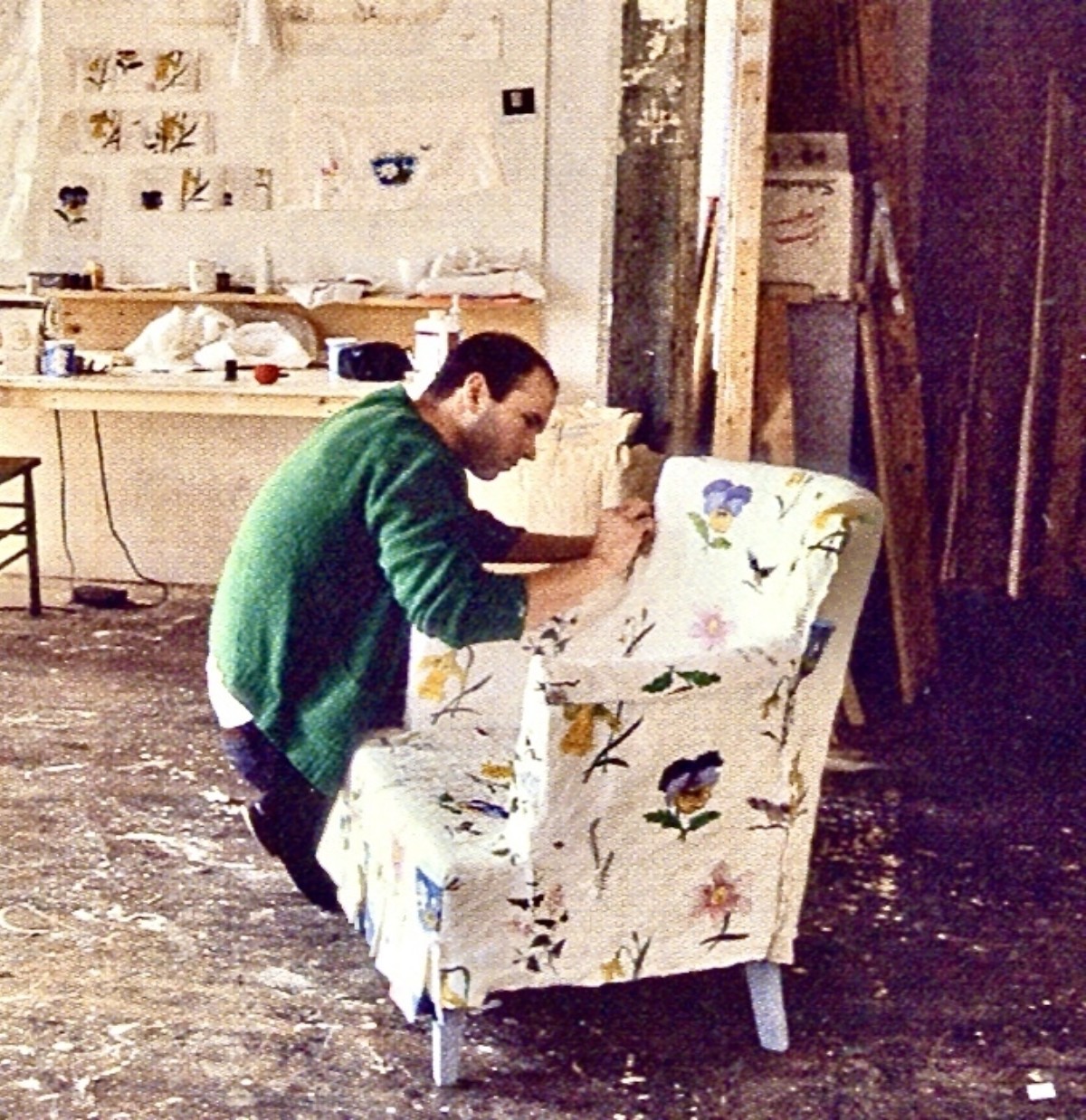<p>The artist working on <em>Slip Covered Armchair </em>in his studio, New York.<br /><em>Untitled</em> (1986–1987) can be seen on the wall behind.</p>